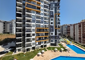 Rent a cozy 1+1 apartment with rich infrastructure in the heart of Mahmutlar