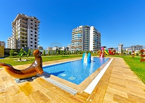 Rent a cozy 1+1 apartment with rich infrastructure in the heart of Mahmutlar