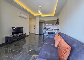 Rent a cozy 1+1 apartment with rich infrastructure in the heart of Mahmutlar