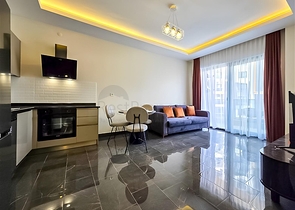 Rent a cozy 1+1 apartment with rich infrastructure in the heart of Mahmutlar