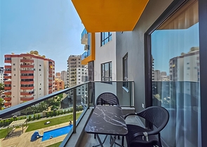 Rent a cozy 1+1 apartment with rich infrastructure in the heart of Mahmutlar