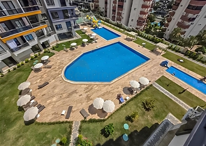 Rent a cozy 1+1 apartment with rich infrastructure in the heart of Mahmutlar