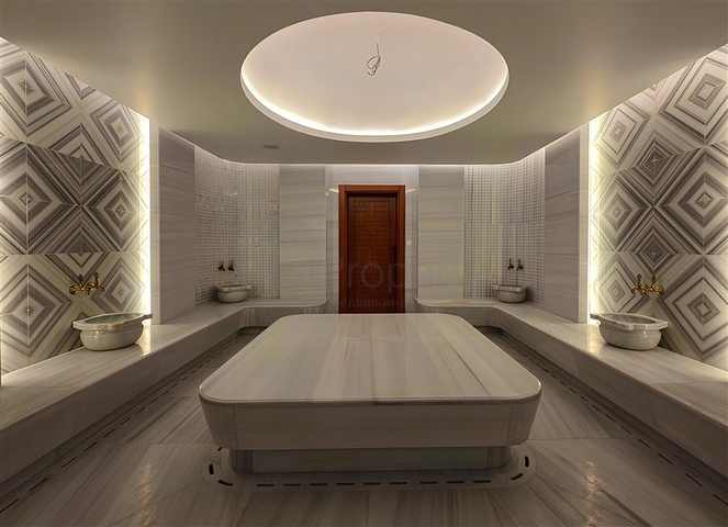 Luxury 3+1 apartment with garden in an elite complex by the sea