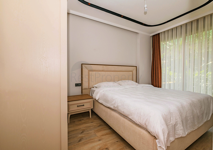 Modern apartment with a garden by the sea in a picturesque area